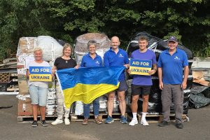 DogsnHomes Rescue Co Founders Gary Baxter far right and Michelle Ballard centre with volunteer team packing pallets for Ukraine. Credit DNH Rescue
